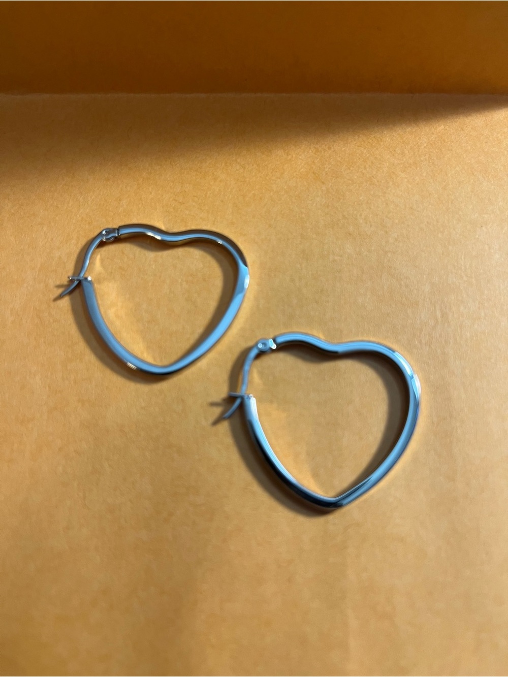 Stately Steel Heart-Shaped Hoop Earrings - Women's Jewelry easy on and off.